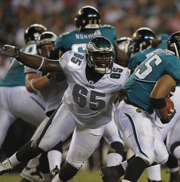 Josh Gaines rushing the passer, number 65